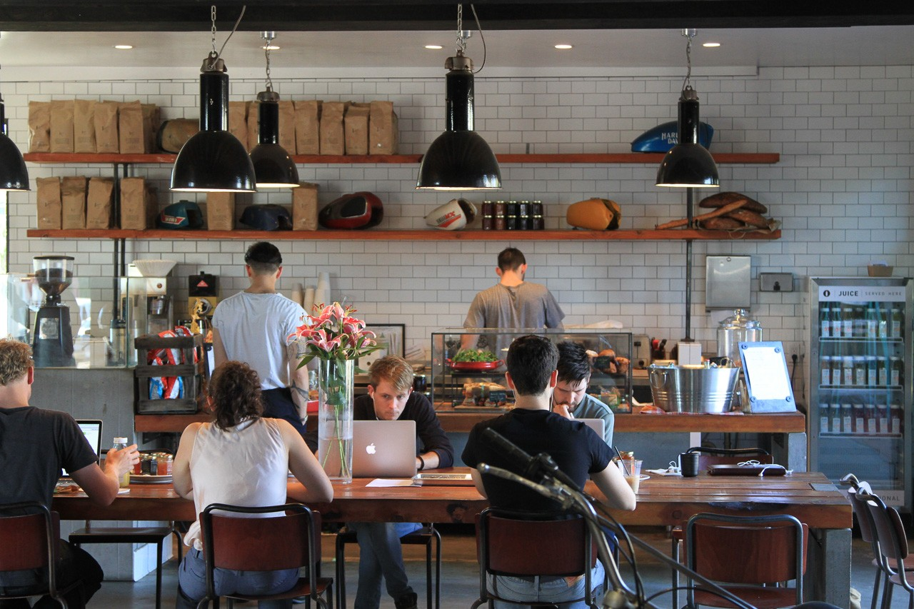 people working in cafe